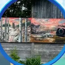 Nature's Mural by Amy-Médéa Chartier: two painted panels of birches, an owl and a sunset over a lake, on a weathered wooden fence